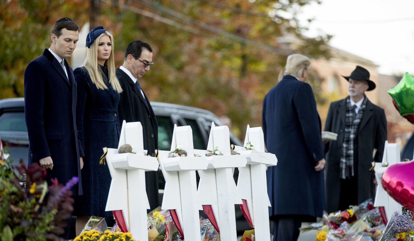 From left, White House senior adviser Jared Kushner, Ivanka Trump, Treasury Secretary Steven Mnuchin, US President Donald Trump, and Tree of Life Rabbi Jeffrey Myers visit a memorial for those killed at the Pittsburgh's Tree of Life Synagogue in Pittsburgh on Tuesday. Photo: AP