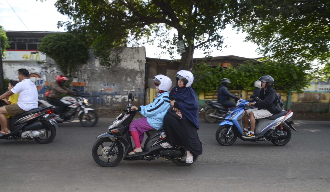 An Ojesy motorcycle taxi in Jakarta. Picture: Anadolu Agency