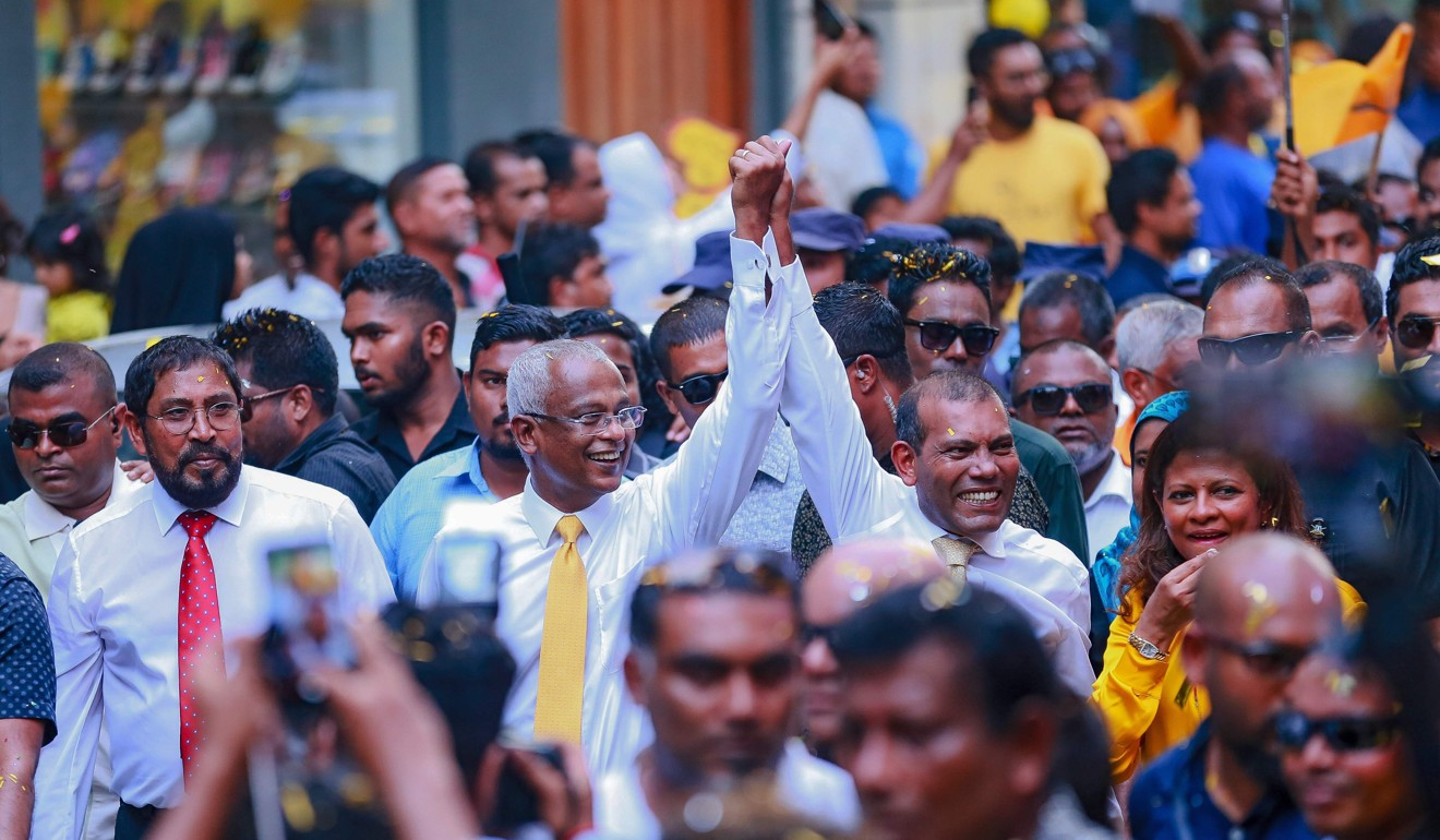 Former president of the Maldives Mohamed Nasheed (right) walks alongside president-elect Ibrahim Mohamed Solih in Male on Thursday.