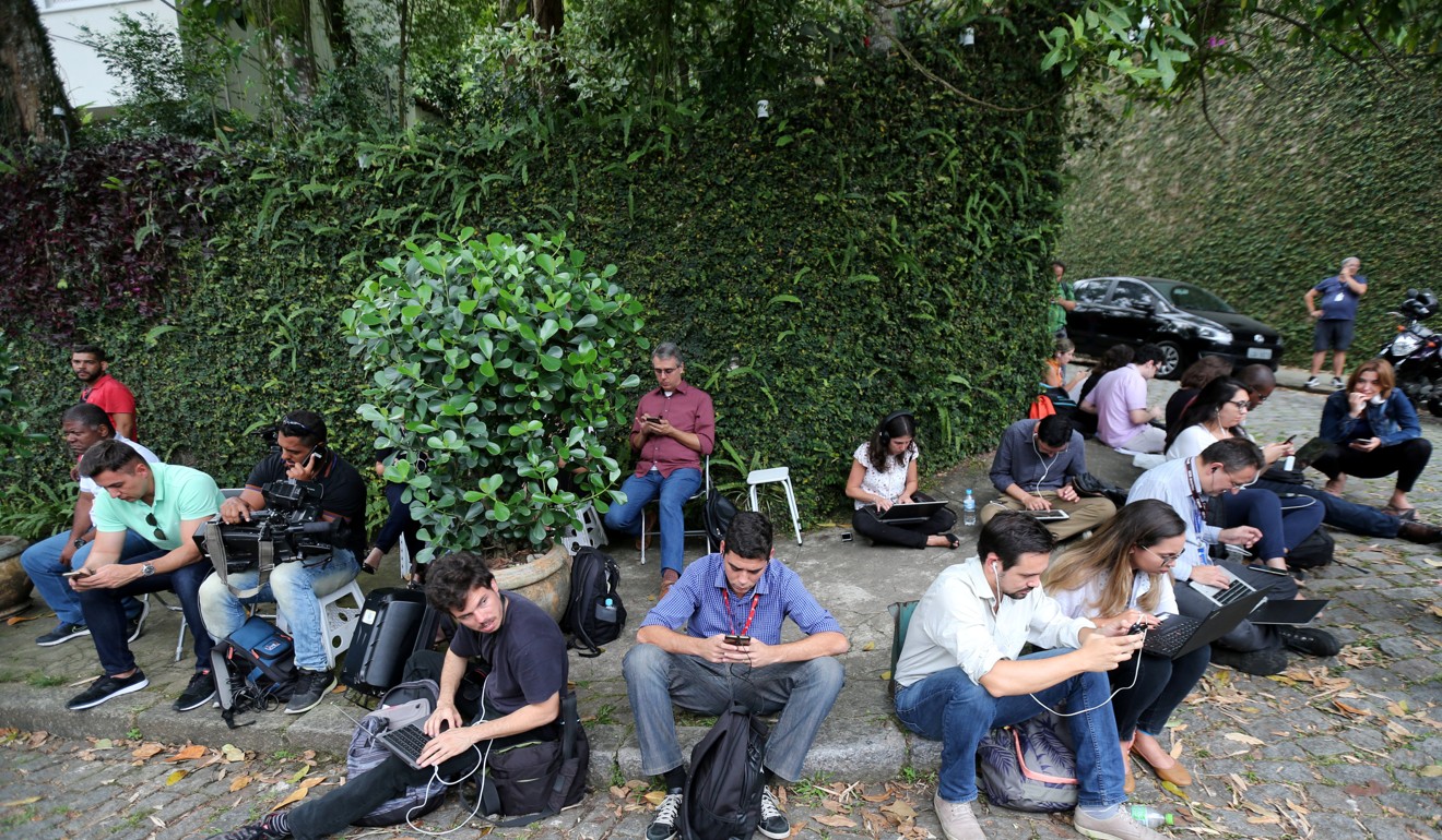 Journalists wait for a meeting between economist Paulo Guedes and the Brazil's new president-elect, Jair Bolsonaro in Rio de Janeiro. Photo: Reuters