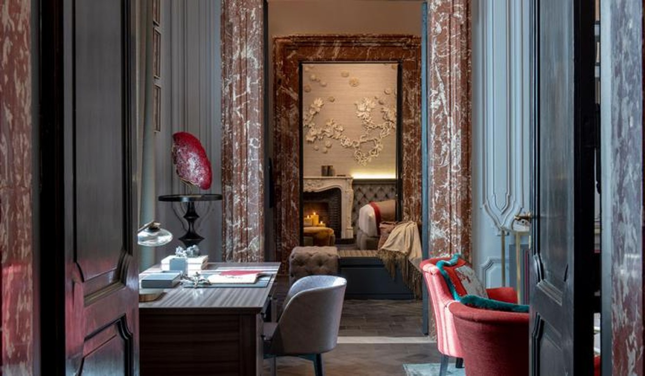 The flat, which has 26-foot-high ceilings and a balcony, overlooks Piazza Navona.
