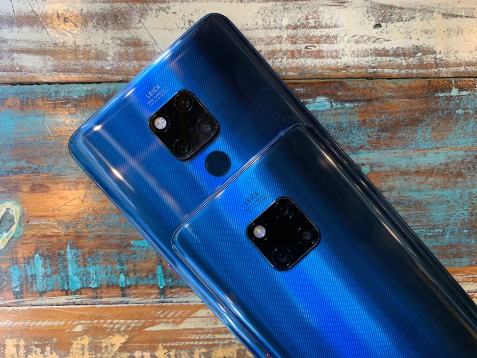 The backs of the Huawei Mate 20 phones are made of glass. The Pro supports wireless charging. Both phones have an identical triple camera system on the back. Photo: Ben Sin