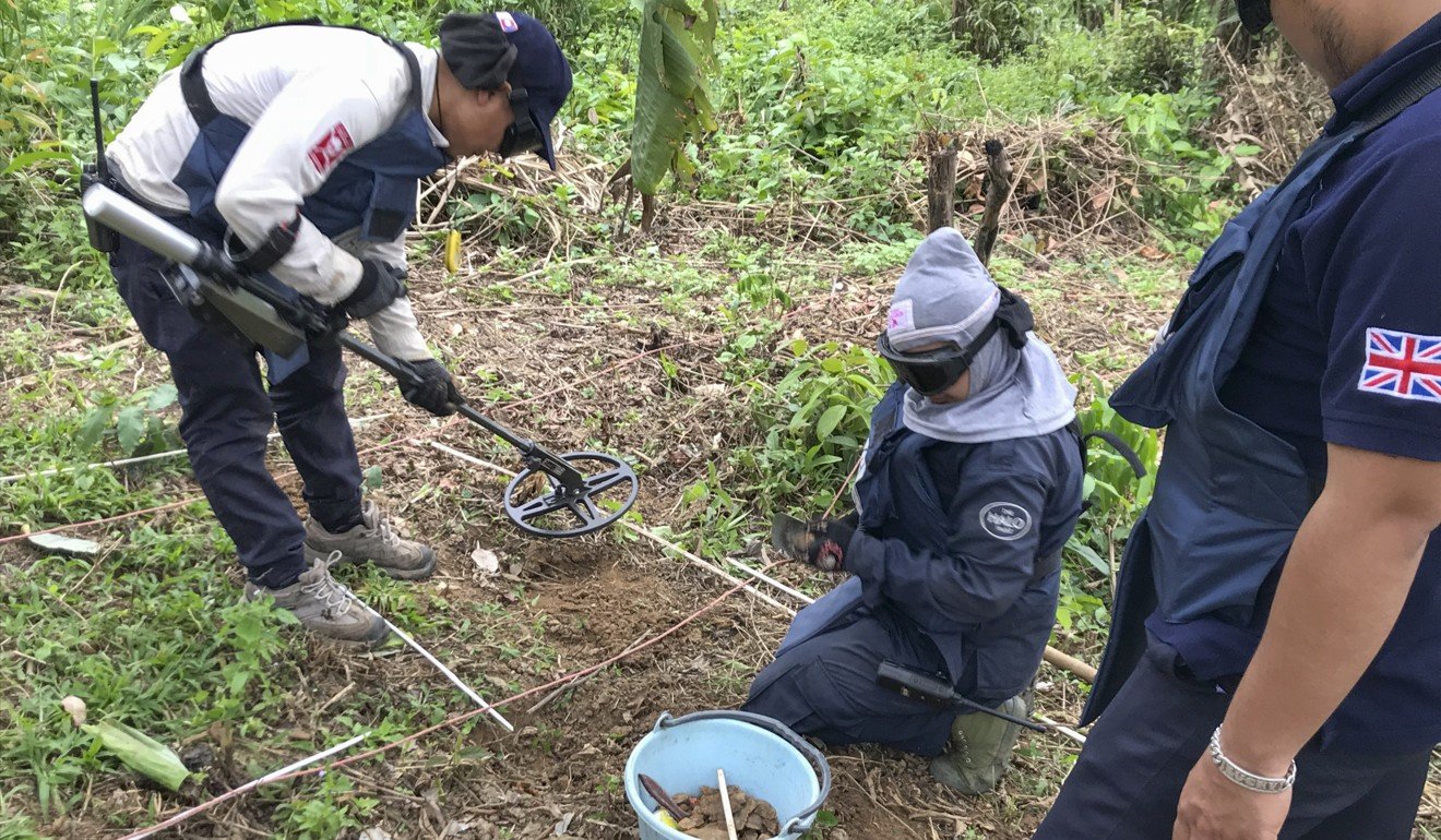 Halo staff remove shrapnel from the ground. Picture: Padraic Convery