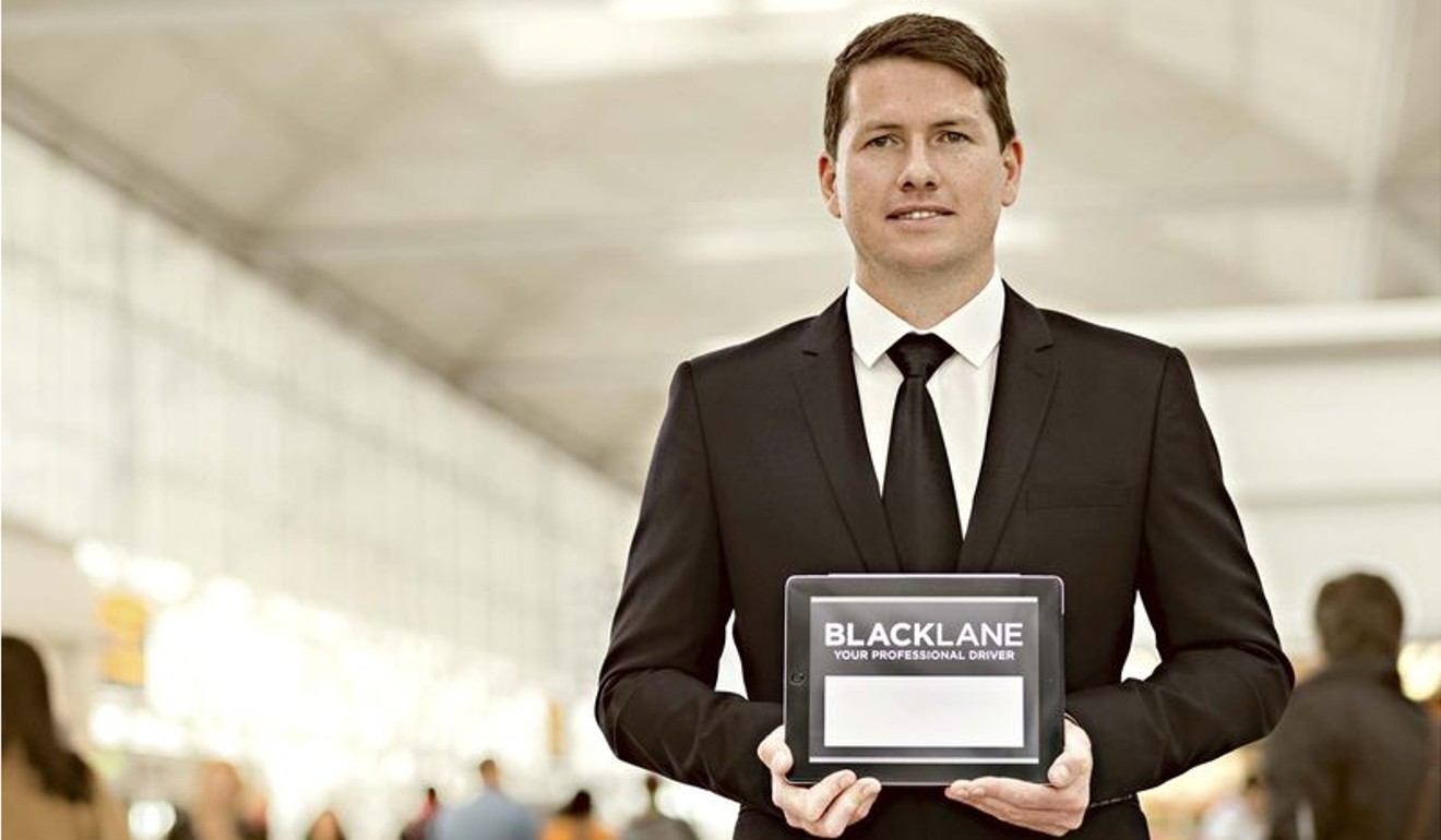 A personal greeter with Blacklane PASS waits for his guest at the airport gate.