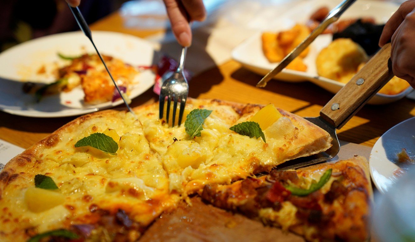 Durian-flavoured foods sold in China include pizza, butter, salad dressing and milk. Image: Reuters