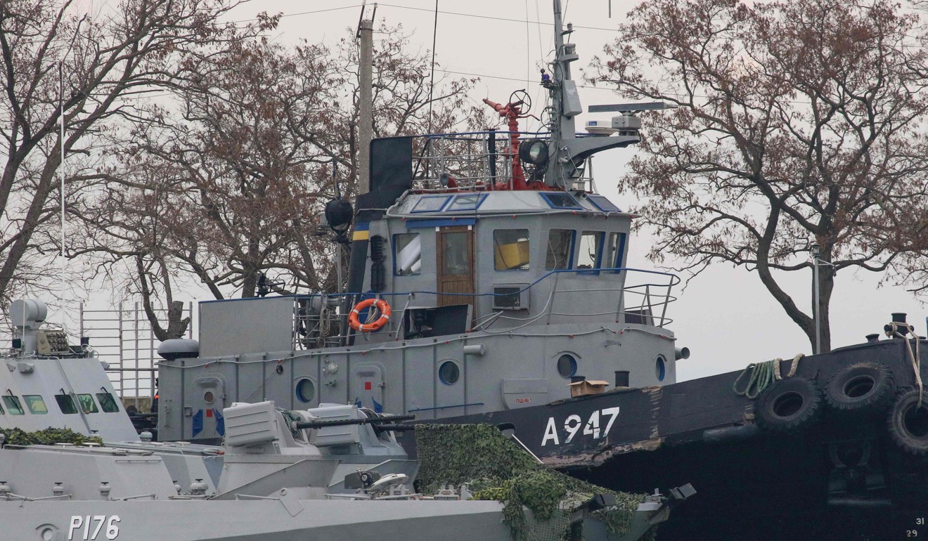 Seized Ukrainian military vessels are seen in a port of Kerch, Crimea, on Monday. Photo: AFP