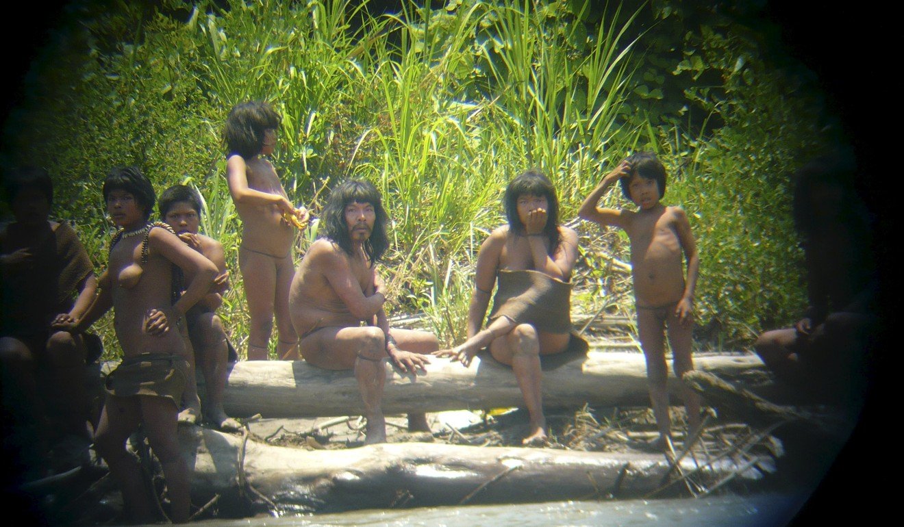 Members of the Mashco Piro tribe observe a group of travellers from across the Alto Madre de Dios river in the Manu National Park in the Amazon basin of southeastern Peru. File photo: Reuters