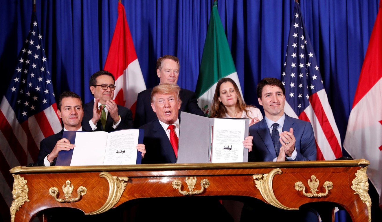 Nieto, Trump and Trudeau at the signing ceremony on Friday. The revamped accord, called the US-Mexico-Canada Agreement (USMCA), looks a lot like the one it replaces. But enough has been tweaked for Trump to declare victory on behalf of the US workers he claims were cheated by Nafta. Photo: Reuters