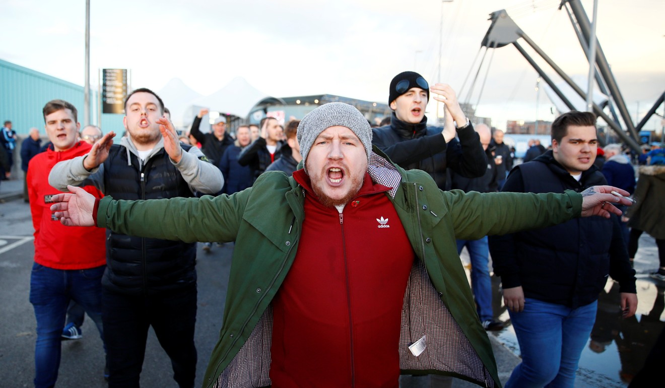 Fans gather outside the Etihad Stadium ahead of the derby match. Photo: Reuters