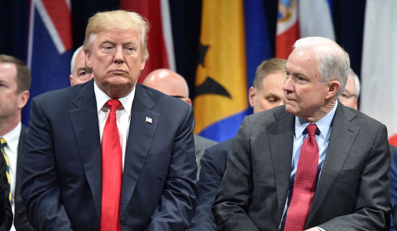 US President Donald Trump sits with then attorney general Jeff Sessions in Quantico, Virginia on December 15, 2017. Photo: AFP