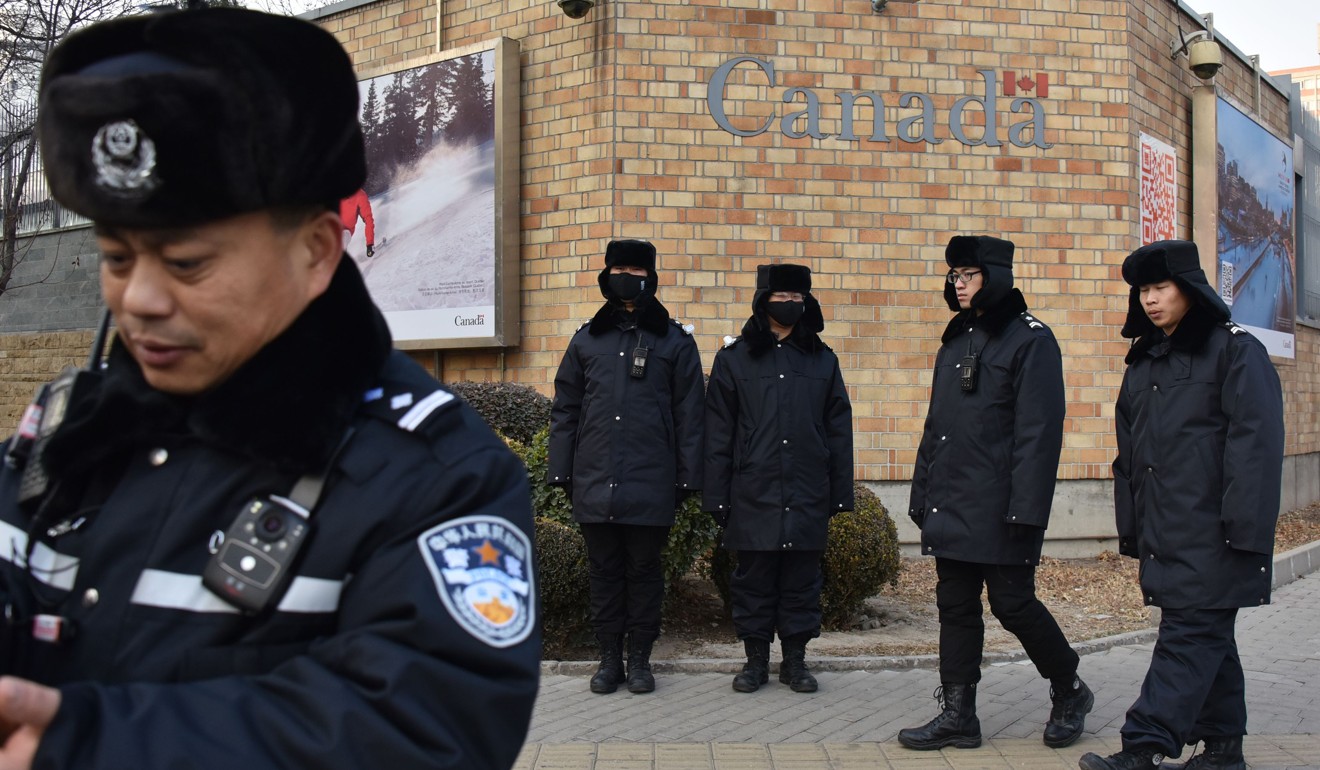 Chinese police officers patrol outside the Canadian embassy in Beijing as the diplomatic stand-off between the two nations over the detention of Sabrina Meng Wanzhou brews. Photo: AFP