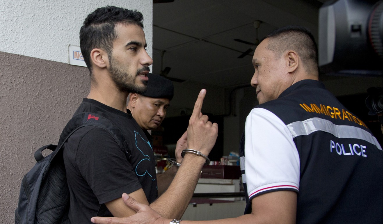 Araibi being escorted into court in Bangkok. Photo: AP