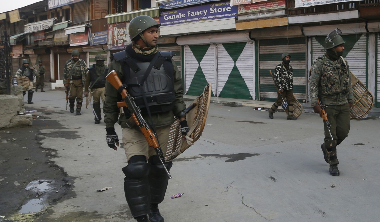 Indian paramilitary soldiers patrol a closed market area during a strike in Srinagar, Indian-controlled Kashmir. Photo: AP