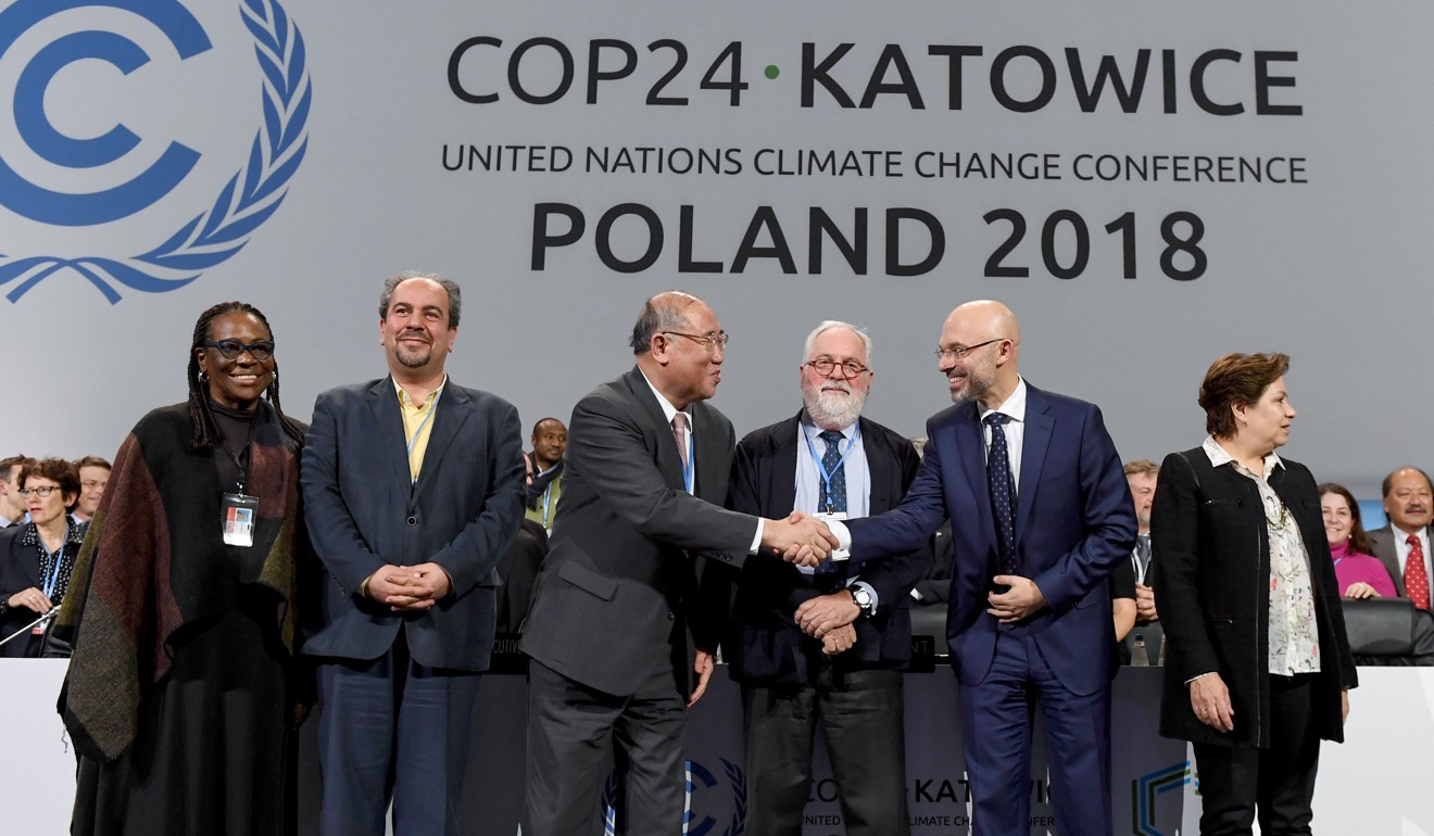 (From L to R) UN climate chief Patricia Espinosa, Iran's head of delegation Majid Shafiepour Motlagh, China’s top climate negotiator Xie Zhenhua, European Union’s climate commissioner Miguel Arias Canete, COP24 president Michal Kurtyka react at the end of the final session of the COP24 summit on climate change in Katowice, southern Poland, on December 15, 2018. Photo: AFP