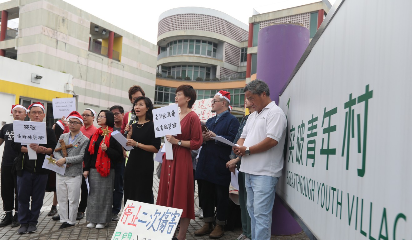 Two former Breakthrough workers, Faye Dorcas Yung, and Minnie Li, along with their supporters, sing Christmas carols outside the Breakthrough Youth Village in Sha Tin. Photo: Xiaomei Chen