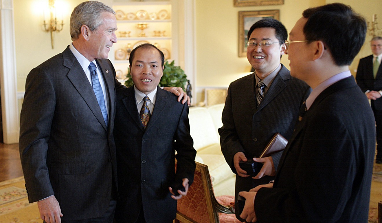 Chinese Christian activists Li Baiguang (second left), Wang Yi (second right) and Yue Jie meet then president George W Bush at the White House in 2006. Photo: AFP