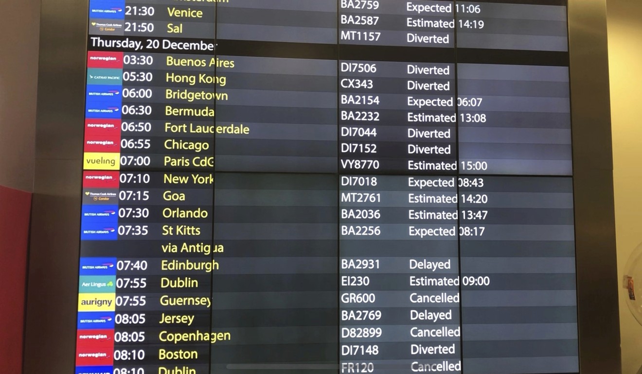 The arrivals board at Gatwick Airport showing cancelled, diverted and delayed flights. Photo: AP