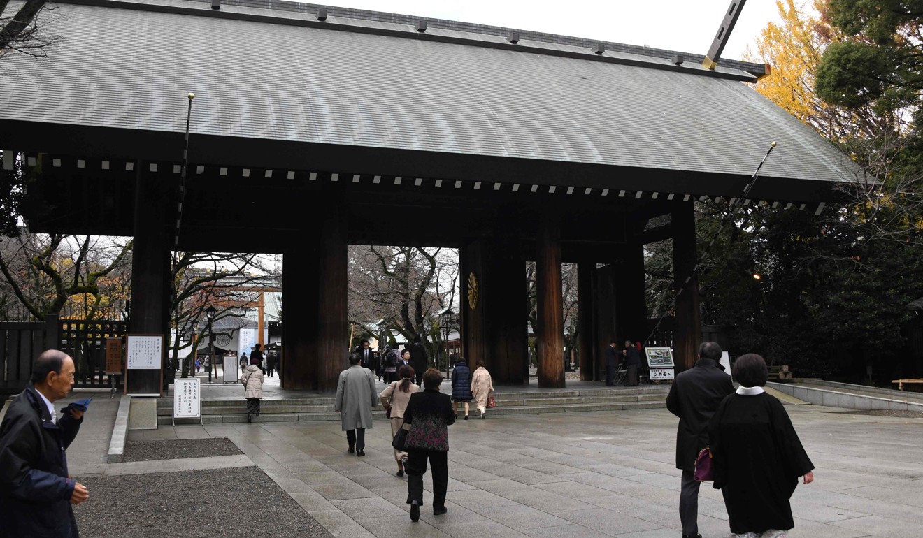People enter through Yasukuni Shrine's main gate in Tokyo. Photo: AFP