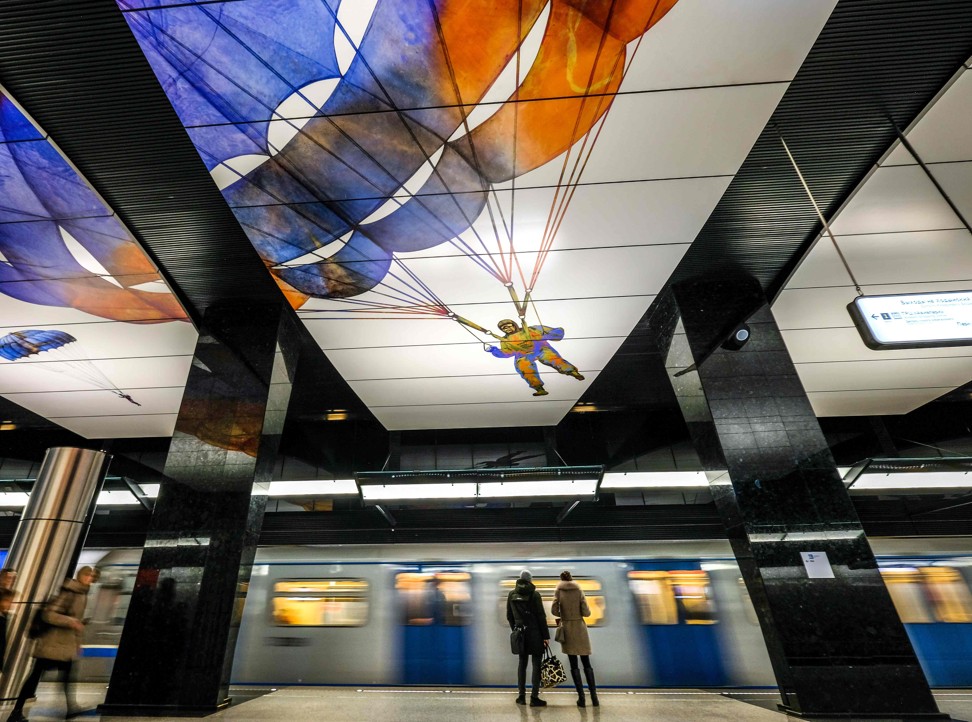 Commuters wait for a train at CSKA /TSSKA/ metro station in Moscow. Photo: AFP