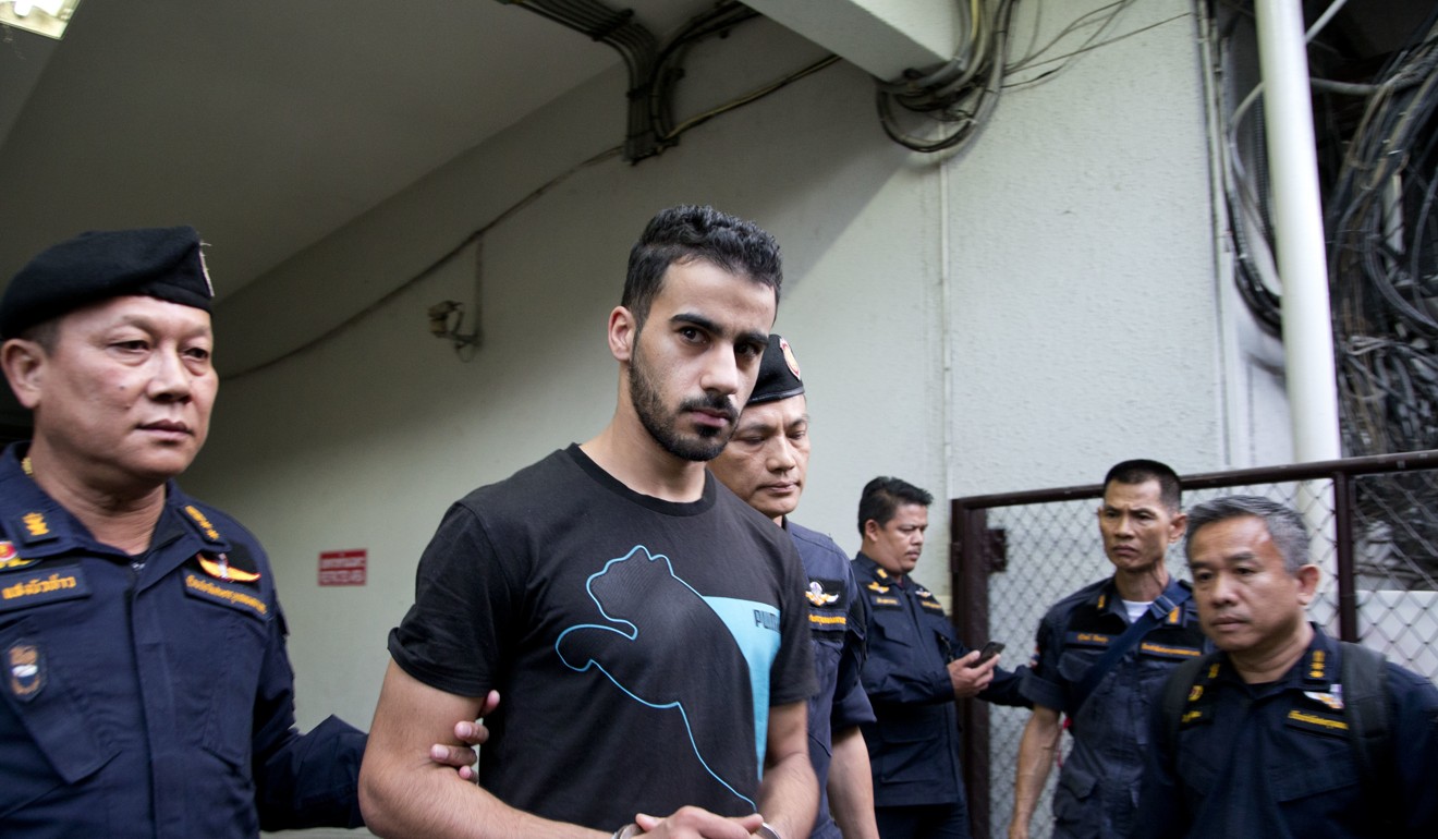 Hakeem al-Araibi being led away by Thai police. Photo: AP