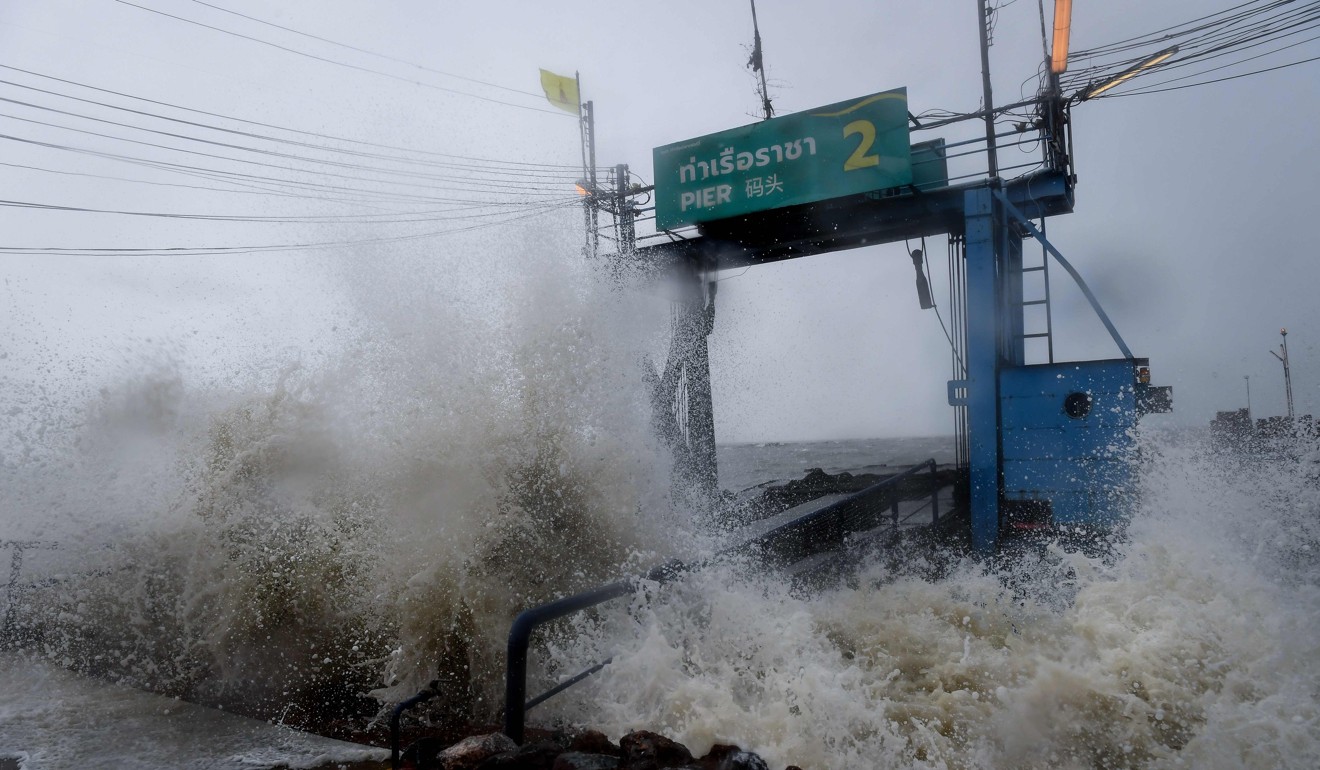 Waves hit a pier in the southern Thai province of Surat Thani. Photo: AFP