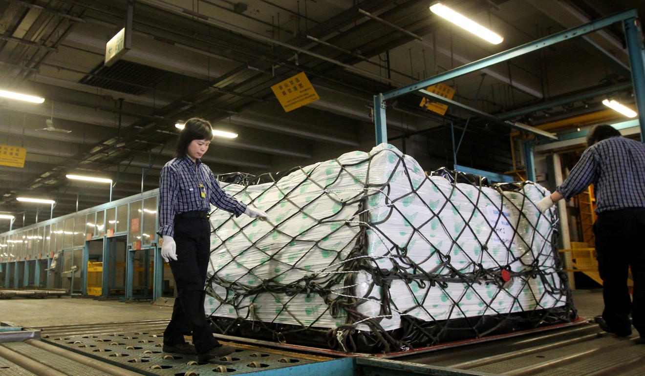 Workers check imported cargo at Hong Kong International Airport. Photo: SCMP Pictures