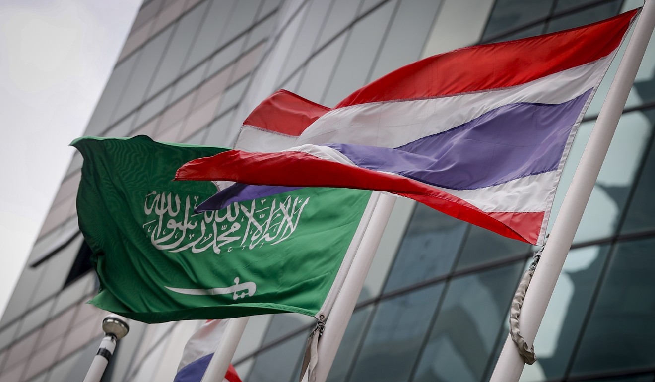 A Saudi Arabian national flag flies next to a Thai national flag outside the Saudi embassy in Bangkok. Photo: EPA