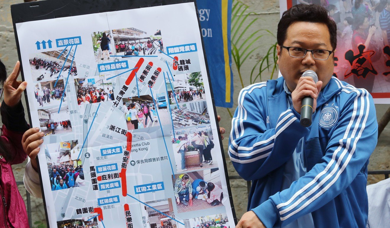 A community activist uses a map to illustrate the problems tour groups are causing in Hung Hom. Photo: Edmond So