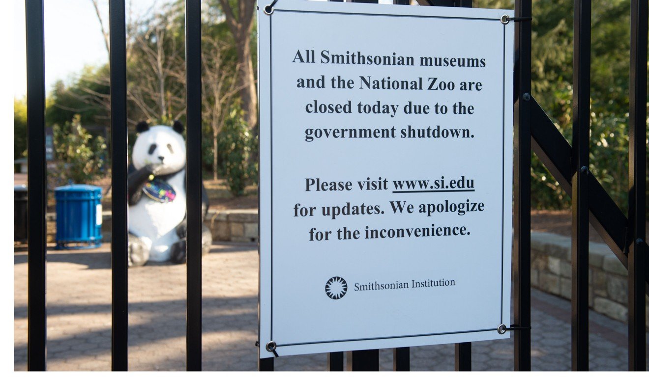 A sign hangs on an entrance gate indicating the Smithsonian National Zoo is closed because of a partial federal government shutdown in Washington, DC. Photo: AFP