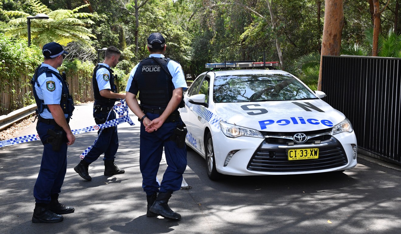 New South Wales police stand guard at the scene of a double stabbing at the Church of Scientology headquarters in Chatswood, Sydney on January 3. Photo: EPA