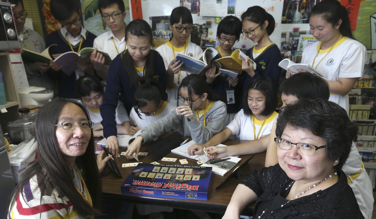Teacher Ma Yan-yan (left) and Principal Florence Man with students at HKTA The Yuen Yuen Institute No. 1 Secondary School in May 2016. Ma ran a group to support new immigrant students. Photo: K.Y. Cheng