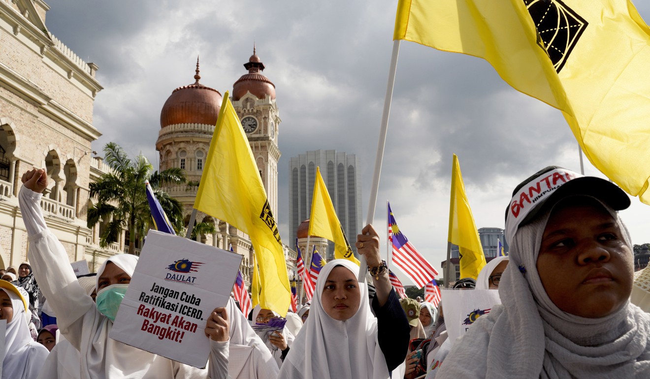 Protesters in take a part in a rally in Kuala Lumpur against a UN anti-discrimination convention. Photo: AP
