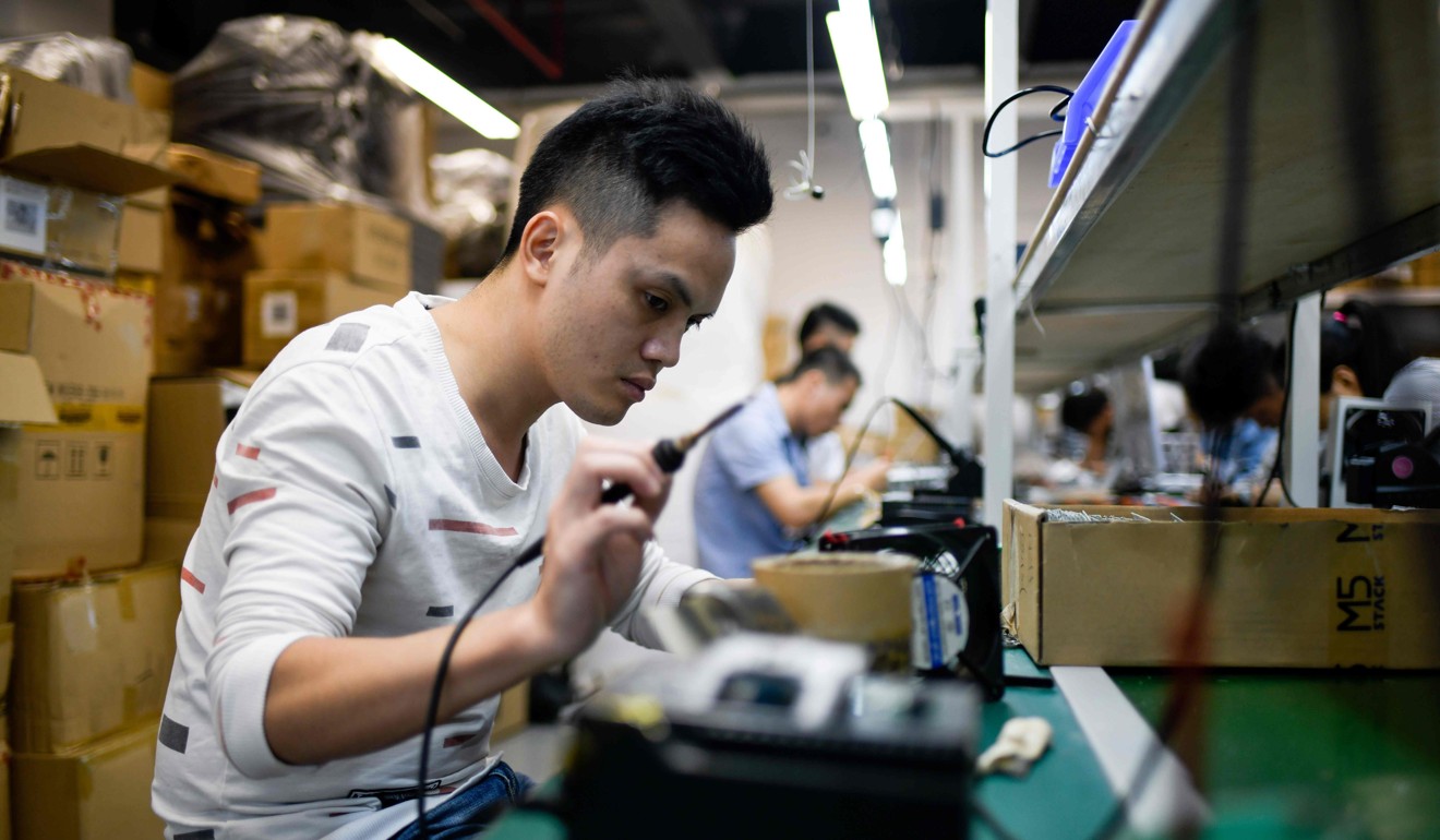 An employee works at a company producing robots in Shenzhen, Guangdong province. Photo: AFP