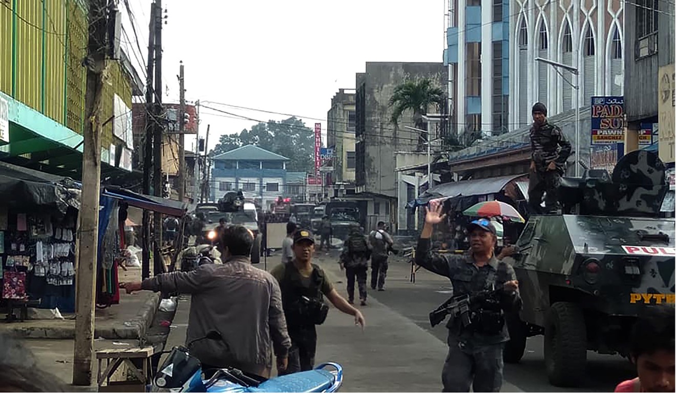 Troops at the scene of the blasts. Photo: AFP