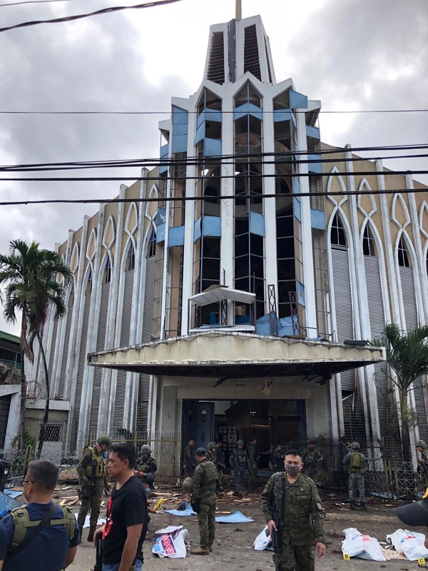 Soldiers in front of the church. Photo by AFP