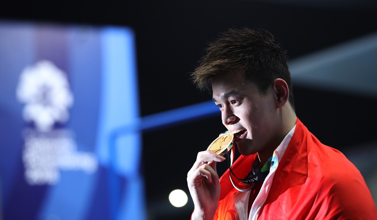 Sun Yang with his gold medal after the Asian Games 2018 men's 1,500m freestyle final. Photo: Xinhua