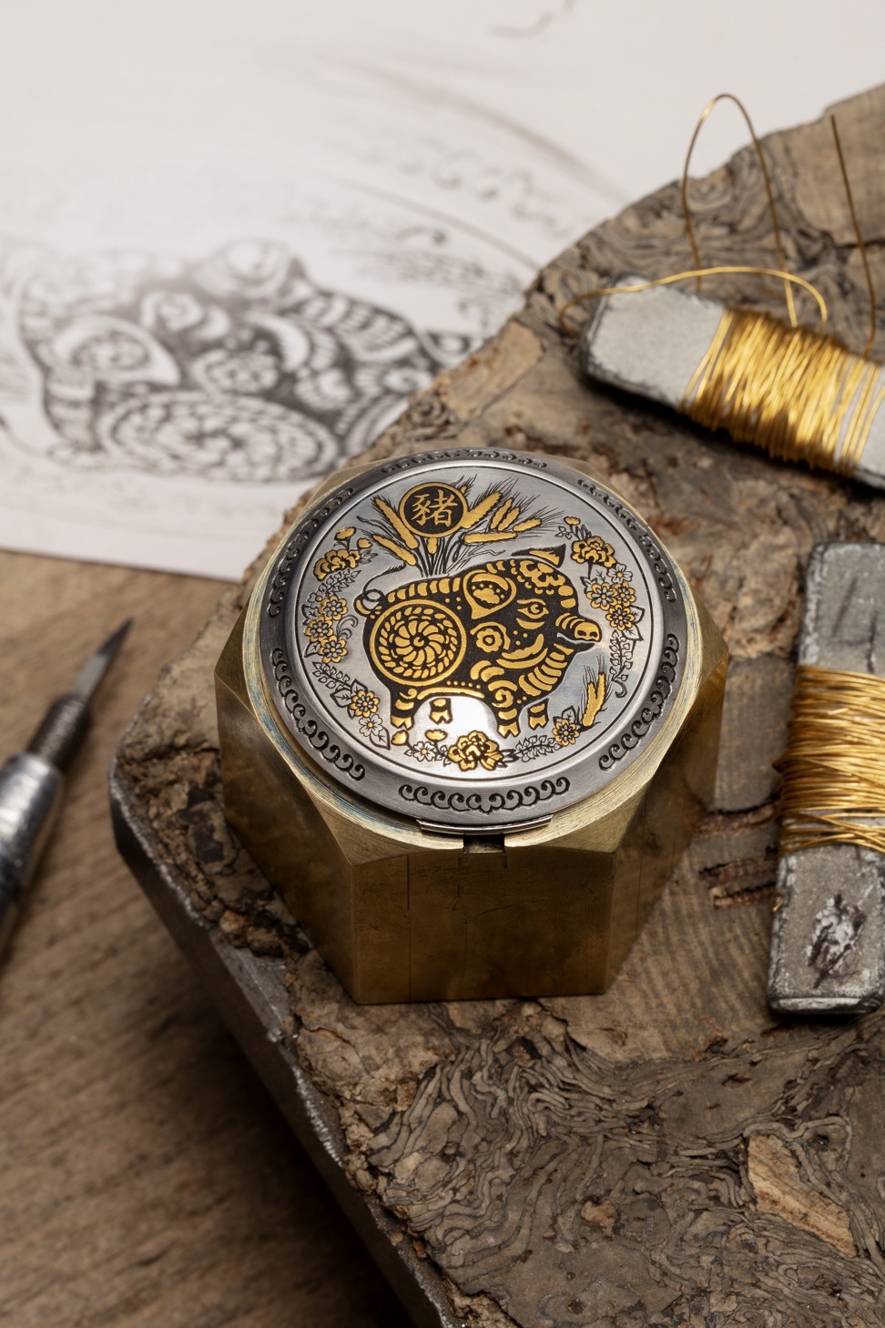 Paneria’s Luminor Sealand Year of the Pig timepiece features a hand-engraved cover inlaid with gold thread.