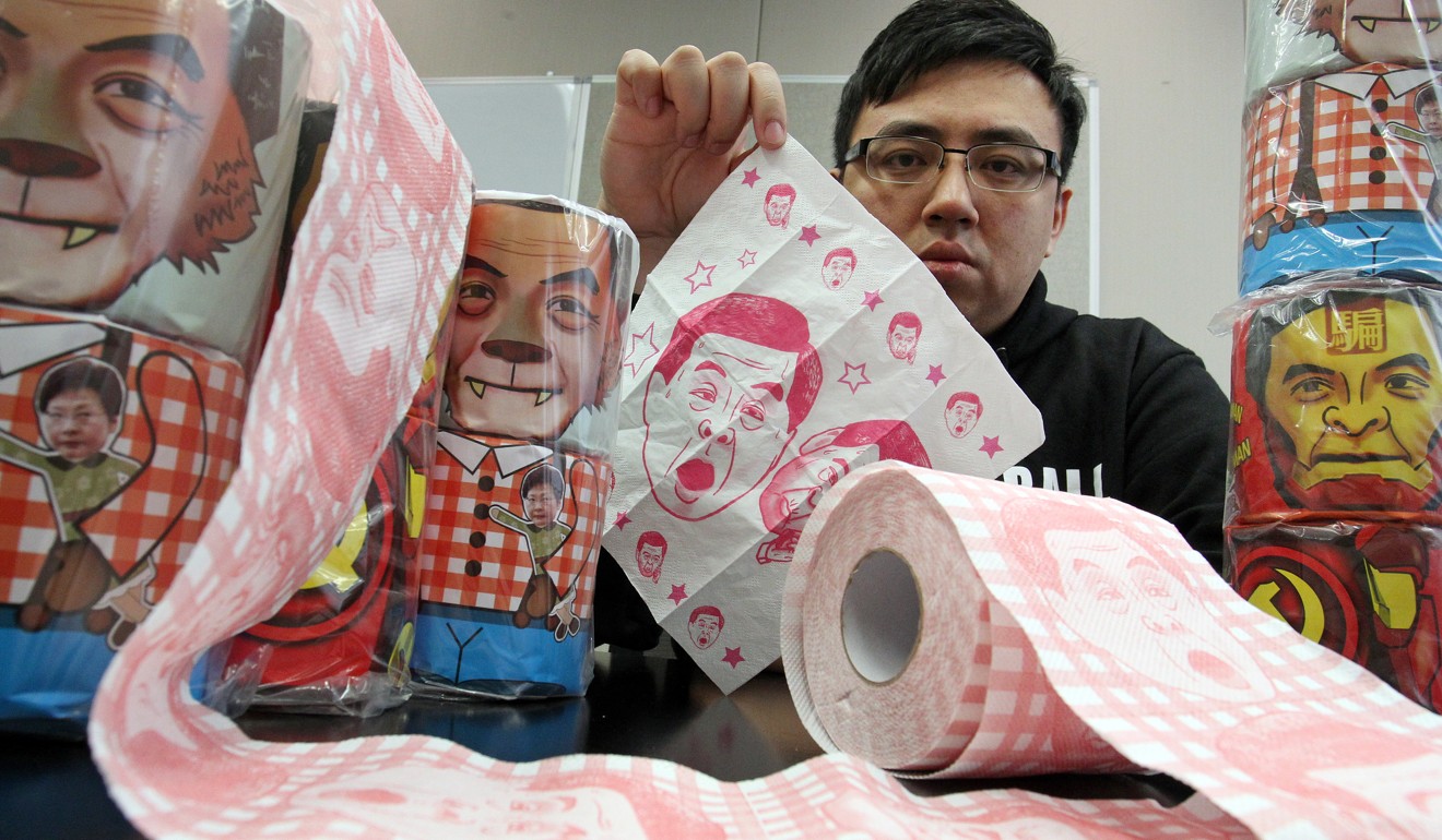 Kelvin Lai King-wai of the Democratic Party, with tissue paper bearing the image of former chief executive Leung Chun-ying. Photo: SCMP