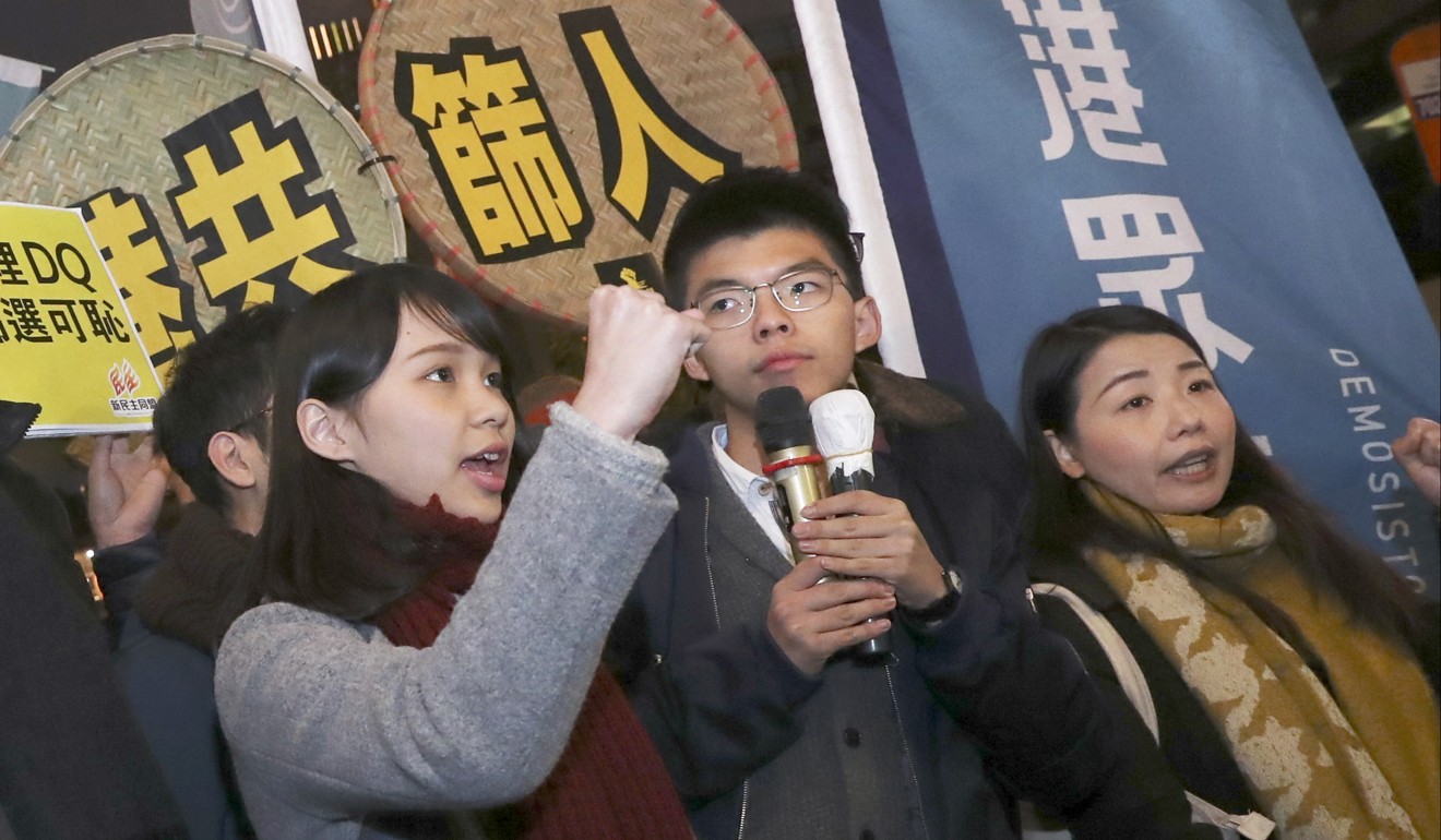Left to right: Agnes Chow, Joshua Wong and Lau Siu-lai protest outside Lai Chi Kok Community Hall on February 1, 2018. Chow and Lau were each disbarred from standing for Legco by-elections last year. Photo: K.Y. Cheng