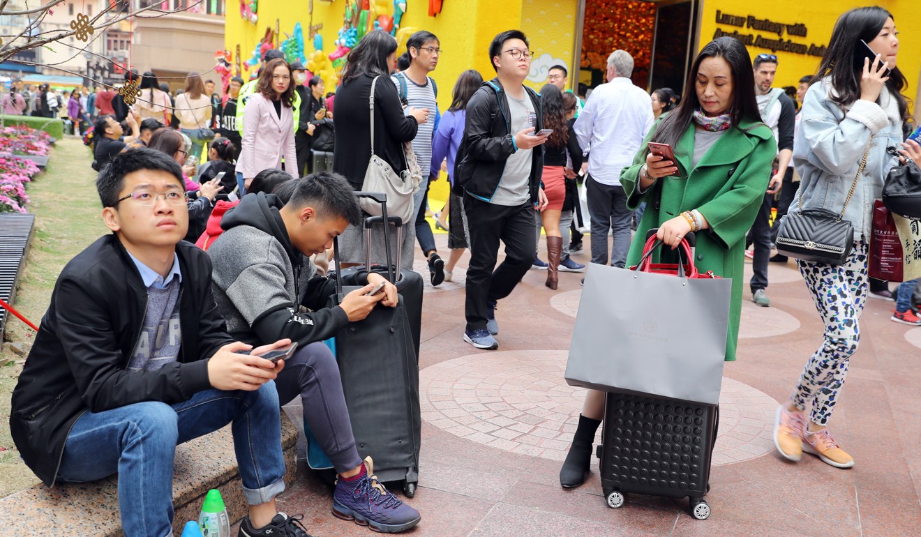 Visitors take a break at the Times Square mall in Hong Kong. Photo: Edmond So