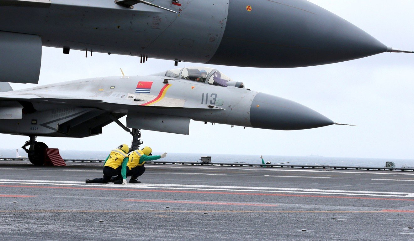 Chinese J-15 fighter jets on the deck of the Liaoning. Photo: AFP
