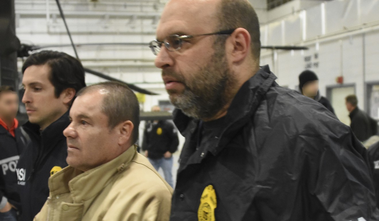 United States Drug Enforcement Administration authorities escort convicted Mexican drug lord Joaquin ‘El Chapo’ Guzman. Photo: AP