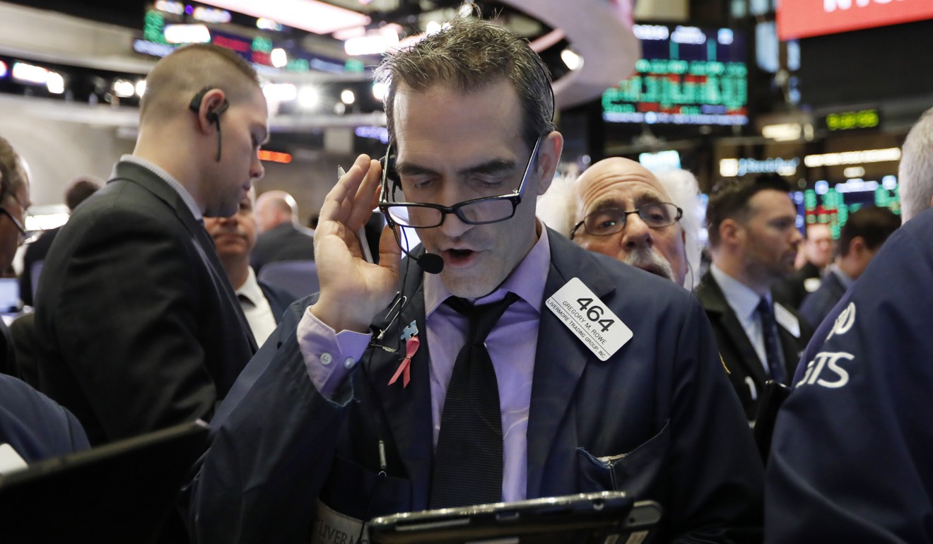 Traders work on the floor of the New York Stock Exchange on Tuesday. Photo: AP