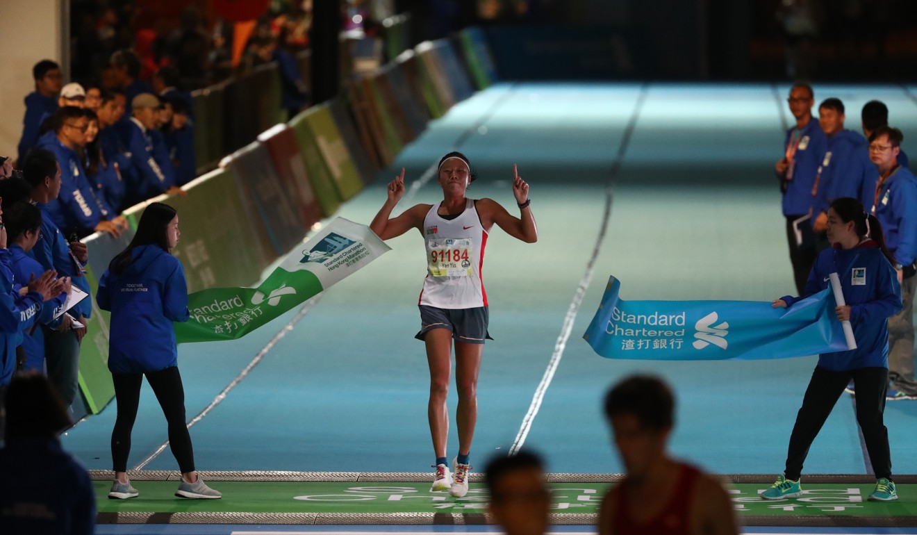 Hong Kong Marathon: photographs of the winners crossing the finish line ...