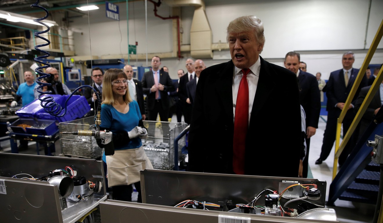 Trump speaks to members of the media as he tours a Carrier factory in Indianapolis, Indiana in December 2016. Photo: Reuters