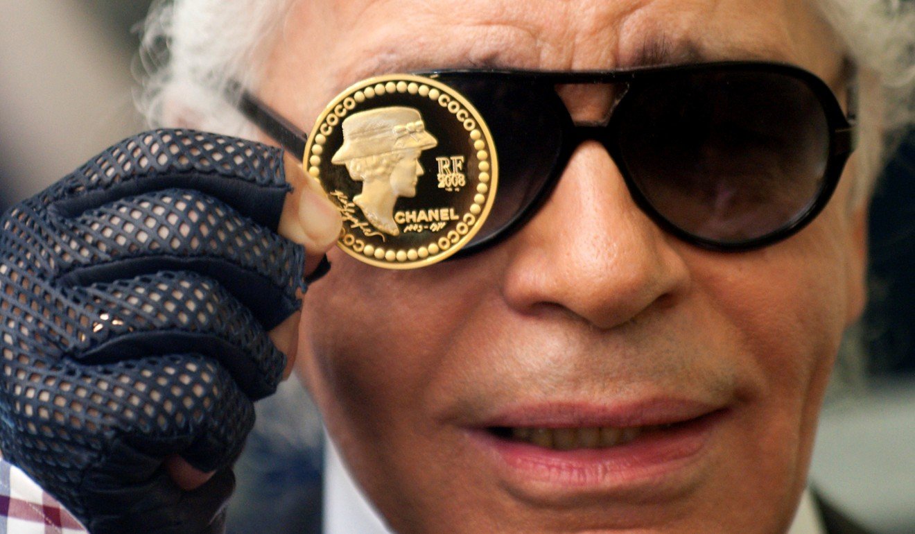 Lagerfeld presents a €5 coin designed by him to commemorate the 125th anniversary of French fashion designer Gabrielle ‘Coco’ Chanel’s birth at the Hotel de la Monnaie, the national mint responsible for making official coins and medals, in Paris in November 2008. Photo: Reuters