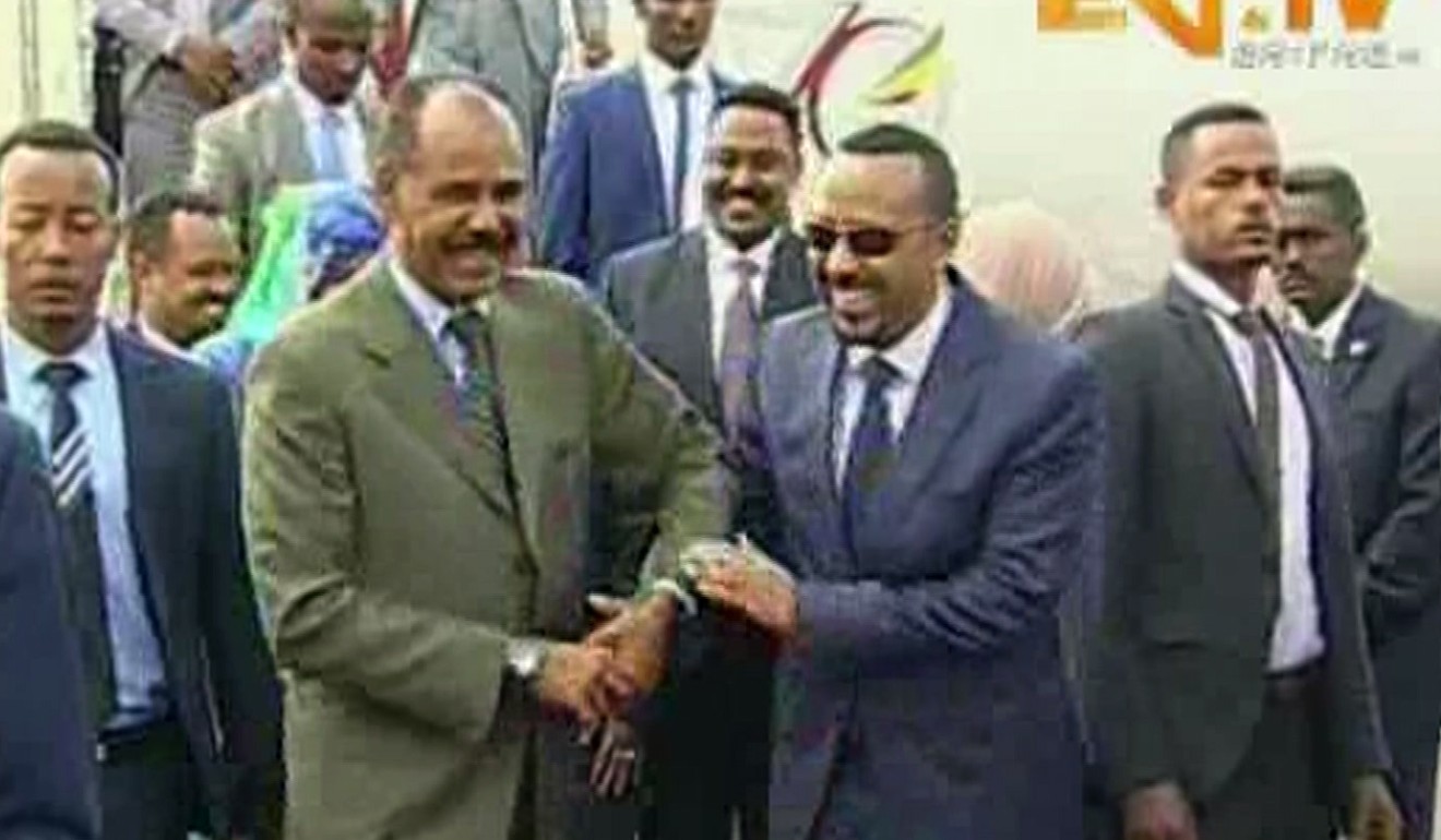 Ethiopia's Prime Minister Abiy Ahmed, centre right, is welcomed by Eritrea's President Isaias Afewerki in July. Photo: AP