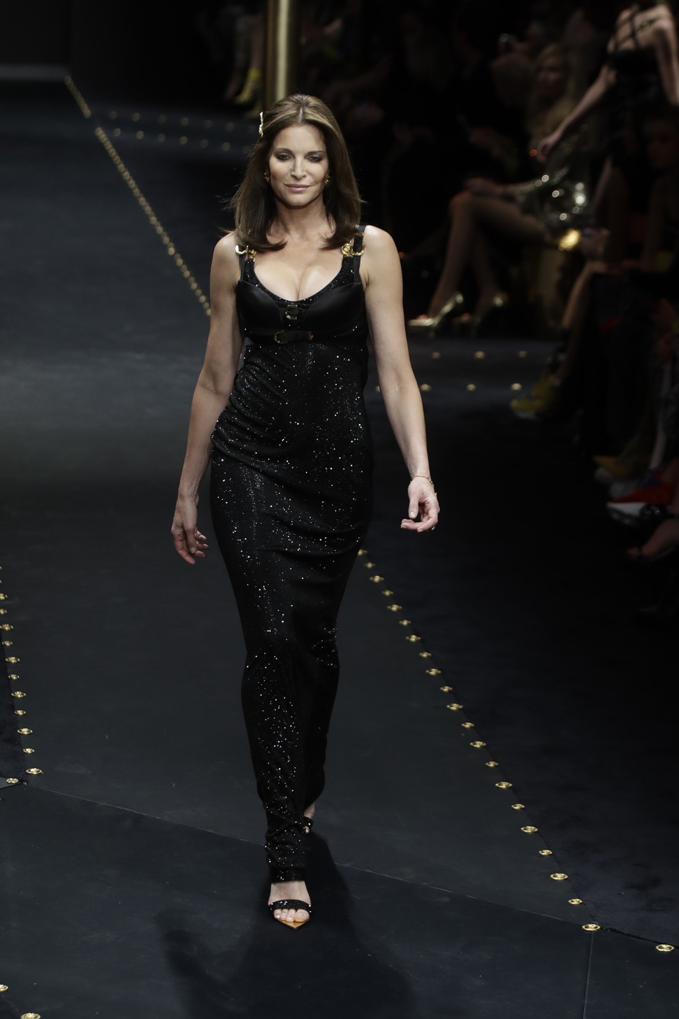 Stephanie Seymour models Versace on the catwalk in Milan. The label is doubling down on its ’90s glamazon aesthetic. Photo: AP