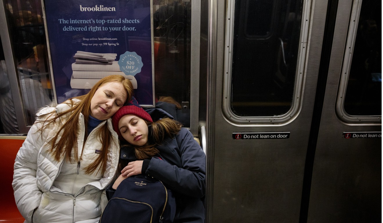 Alexandria rests on her mother Kristin Hogue’s shoulder on the subway after leading a Zero Hour meeting. Picture: for The Washington Post by Sarah Blesener
