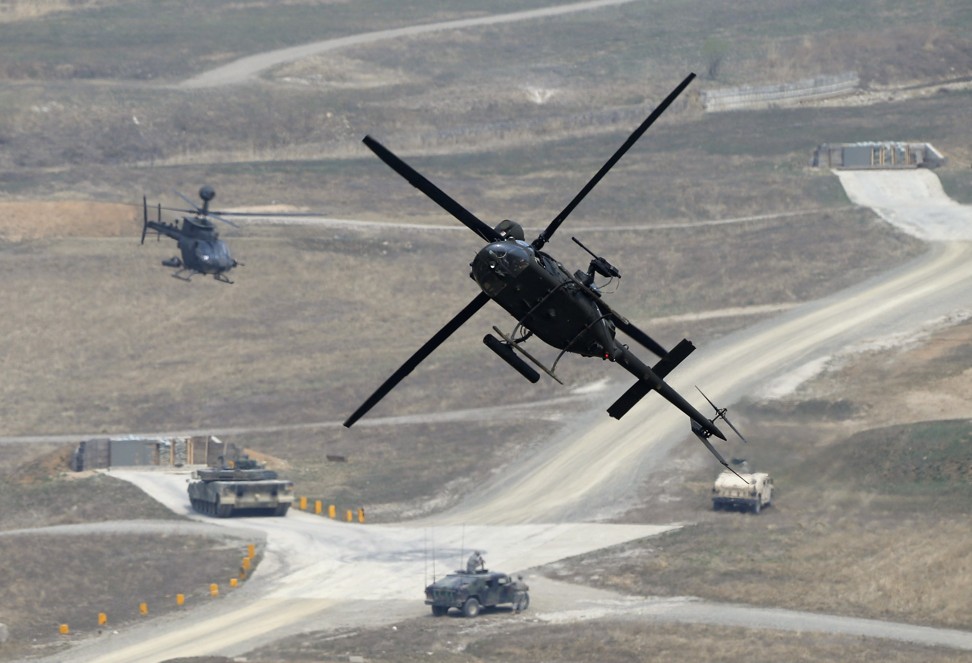 A US army's OH-58D Kiowa Warrior helicopter takes part in the 2014 Foal Eagle exercises in South Korea. Photo: Reuters